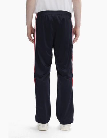 CHAMPION EUROPE<br>ARCHIVE JACQUARD LOGO TAPE TRACK PANTS NAVY