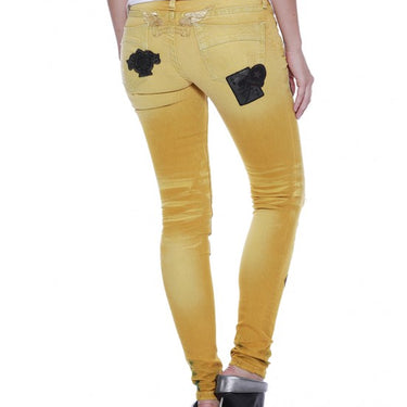 SKINNY WITH PATCHES IN F__UP YELLOW